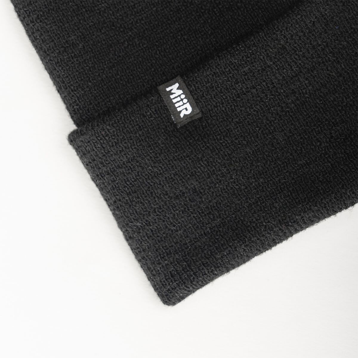 recycled-poly-fine-knit-beanie-i2 WebPDP-RecycledPolyFineKnitBeanie_Studio_TagDetail_Black__BNE005002OS.jpg